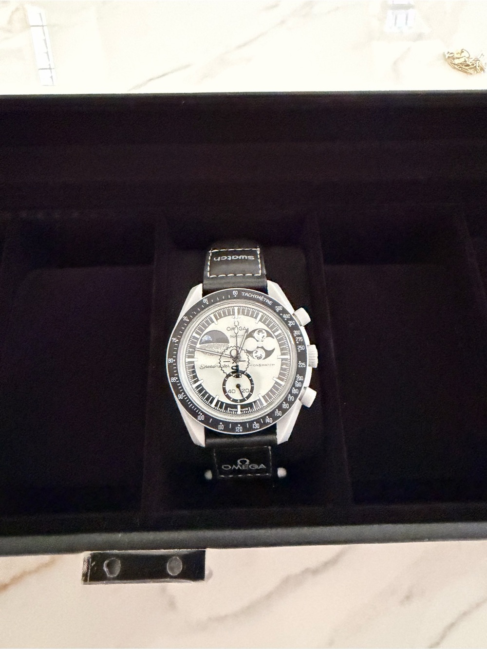 Omega Men's Black and Silver Chronograph Watch